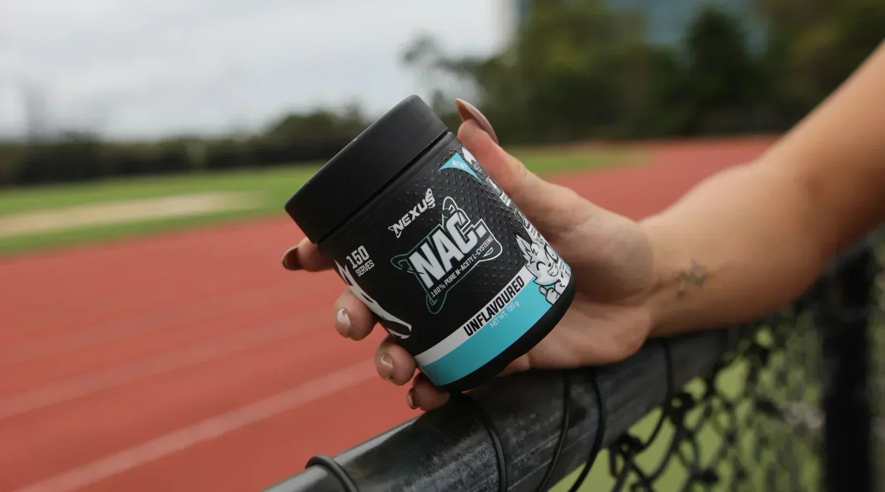 hand holding nexus NAC unflavoured tub at running track